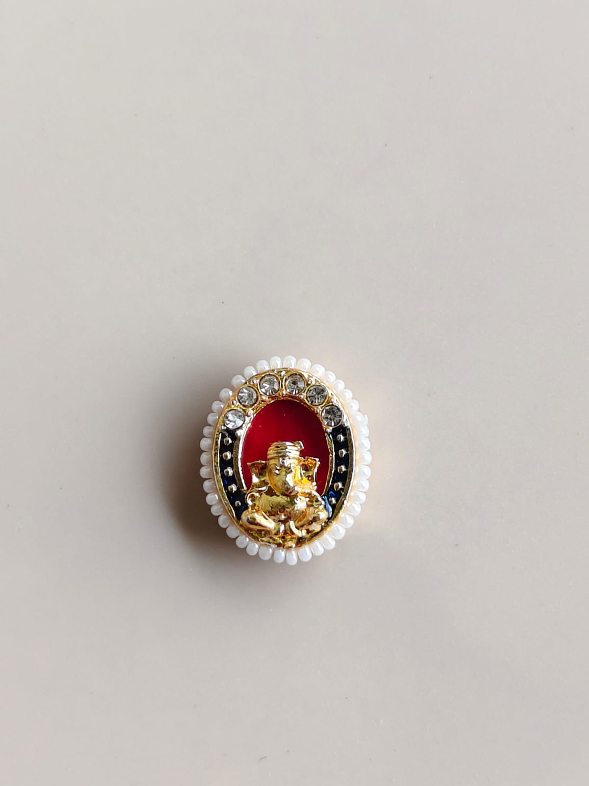 Lord Ganesha Moti Rakhi Charm