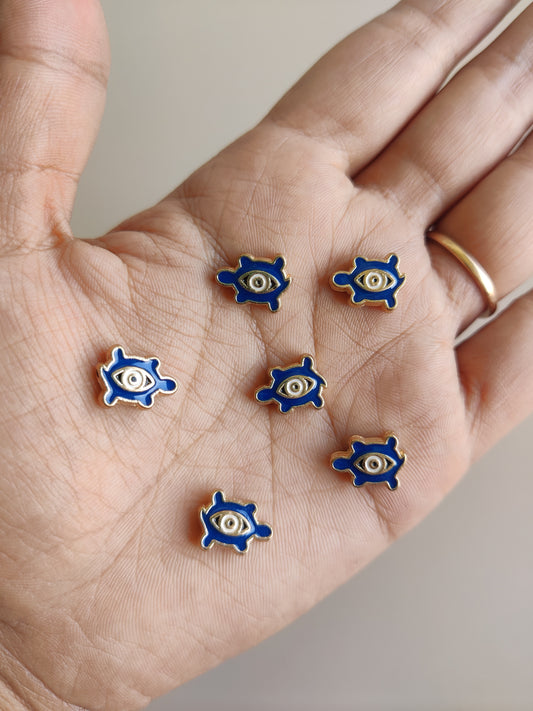 Evil eye tortoise charms